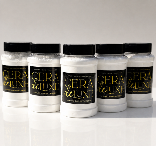 Five jars of Cera De Luxe carpet freshener on a white background